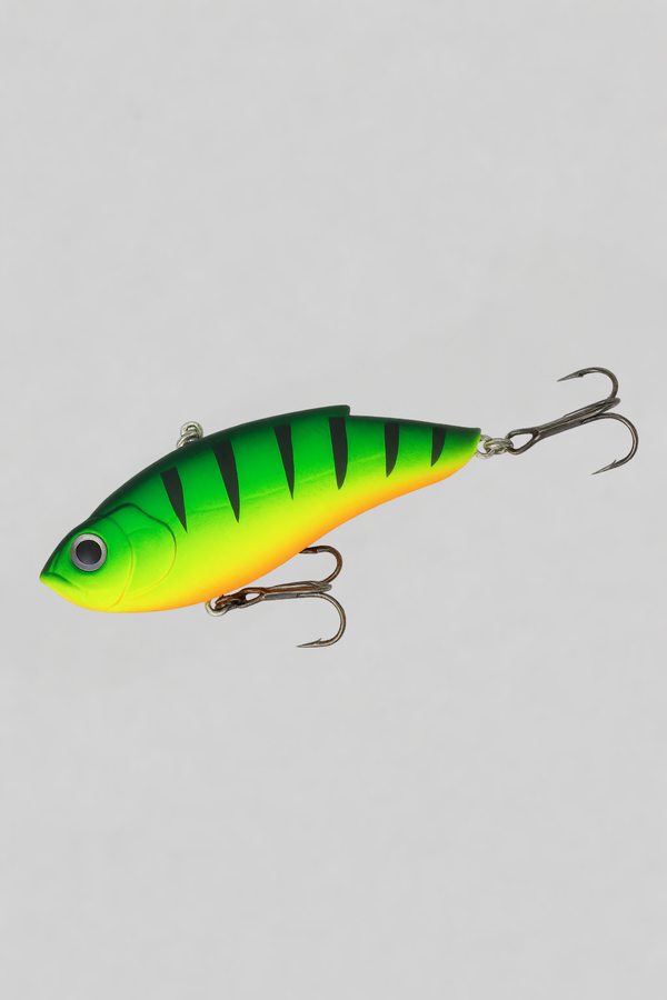 Green and yellow fishing lure on a gray background