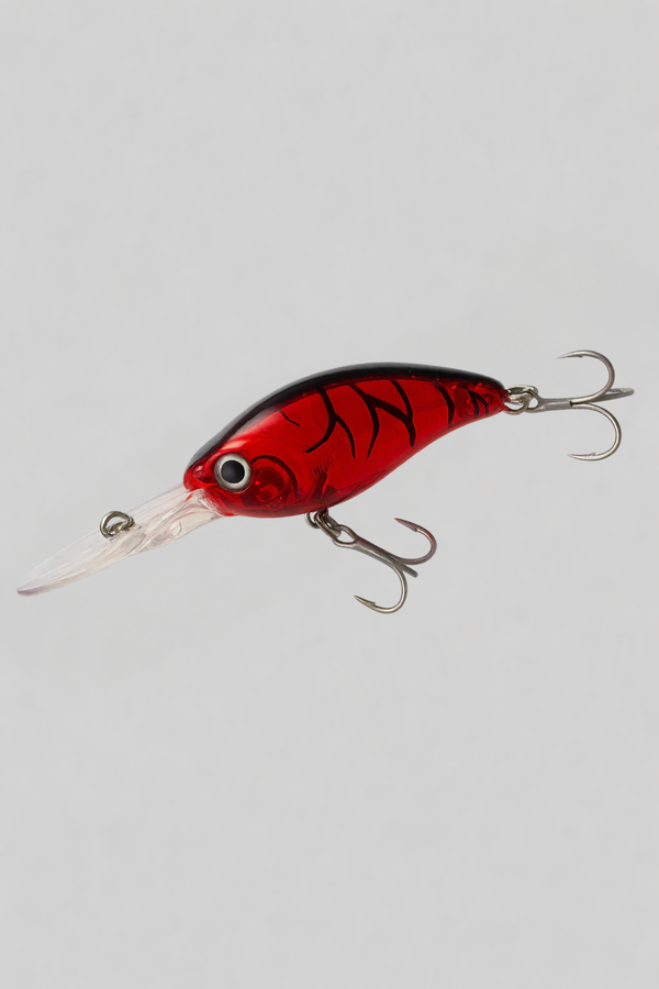 Red and black fishing lure on a gray background