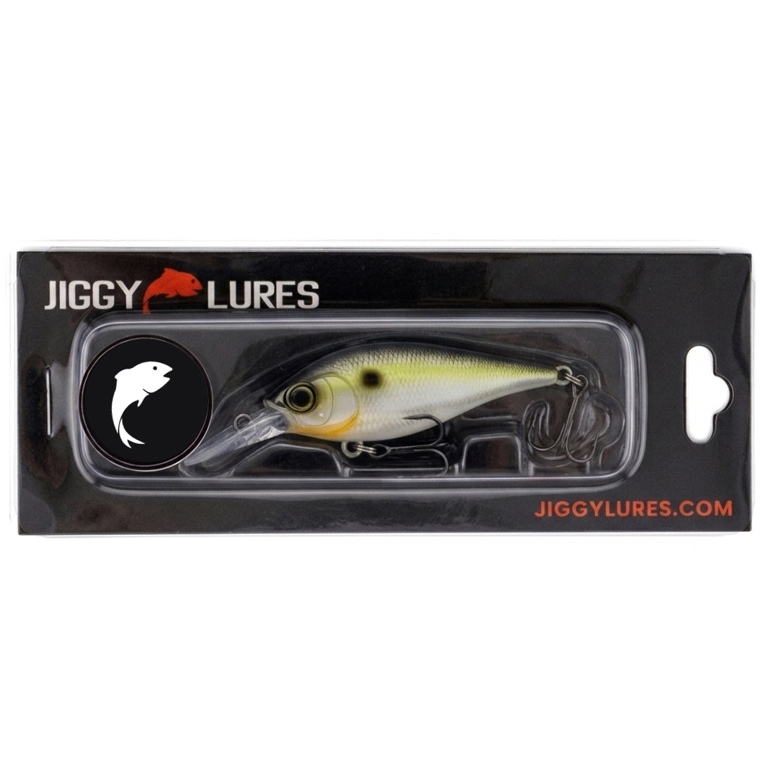 Fishing lure with a white body, black eyes, and three hooks on a white background