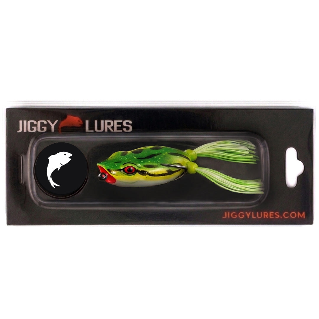 Fishing lure shaped like a frog with green and black pattern on a white background